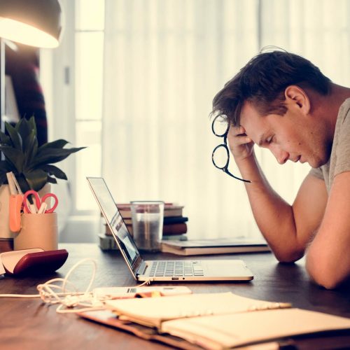 man stressed while working on laptop GDPR - RGPD