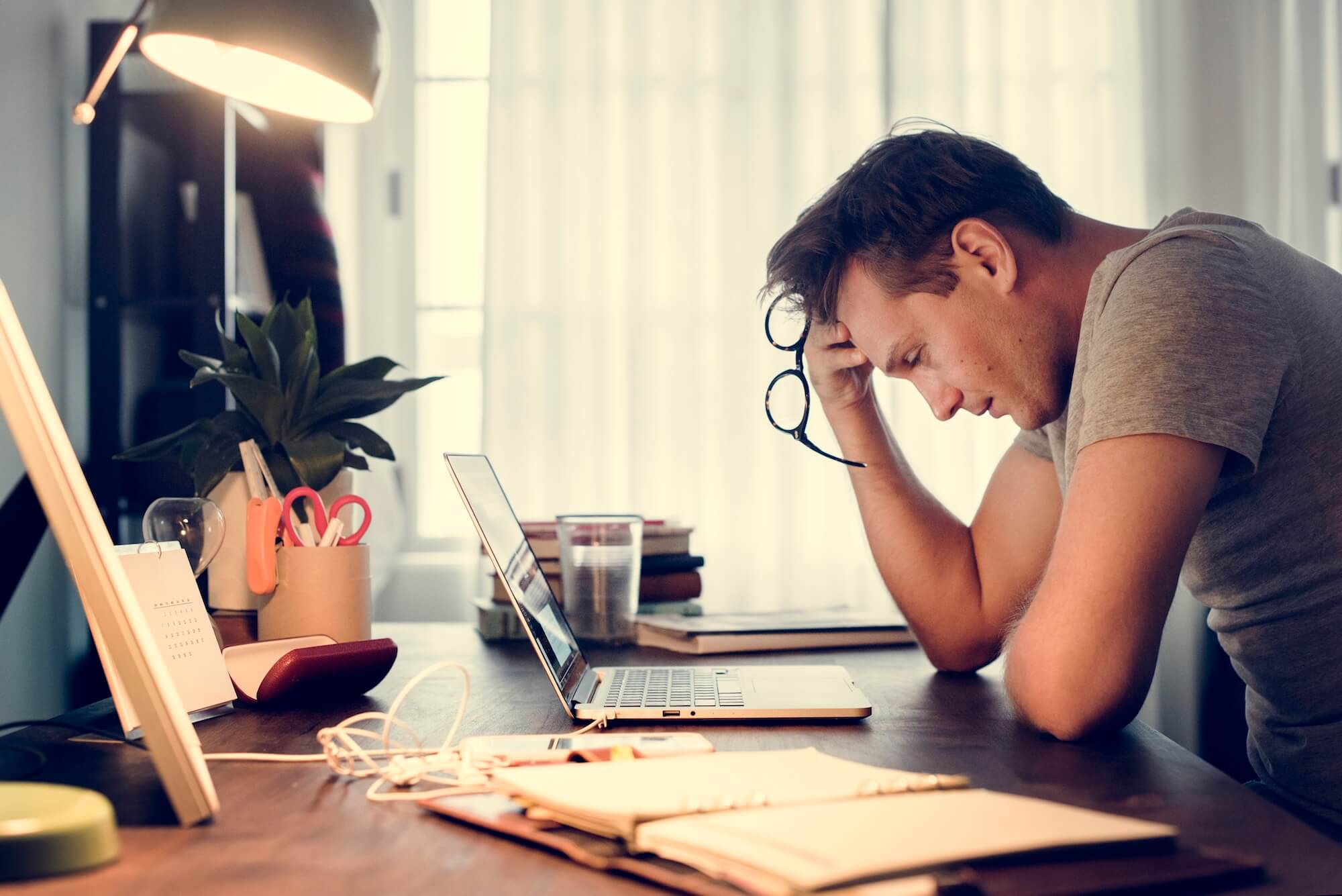 man stressed while working on laptop GDPR - RGPD